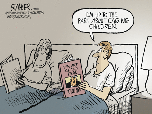 Man and wife in bed reading.  Man, holding copy of 