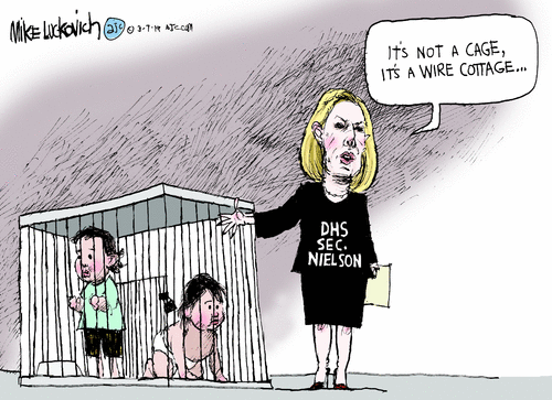 DHS Secretary Nielsen standing next to children in a cage saying, 